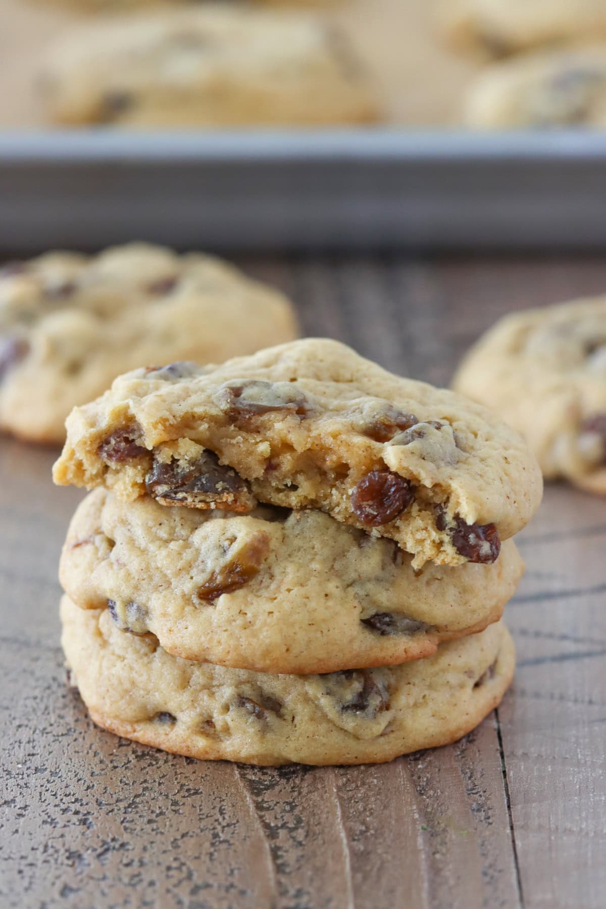 Soft Raisin Cookies (550x367) Soft Raisin Cookies stacked on a table.