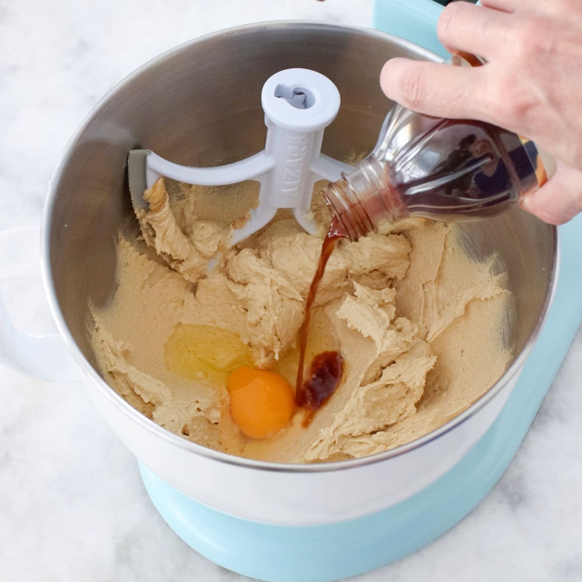 Soft Raisin Cookie dough - adding eggs and vanilla.