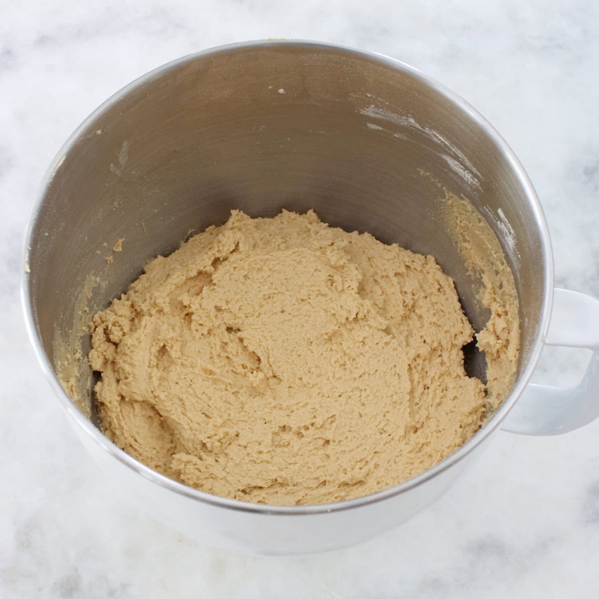 Soft raisin cookie dough in a bowl.