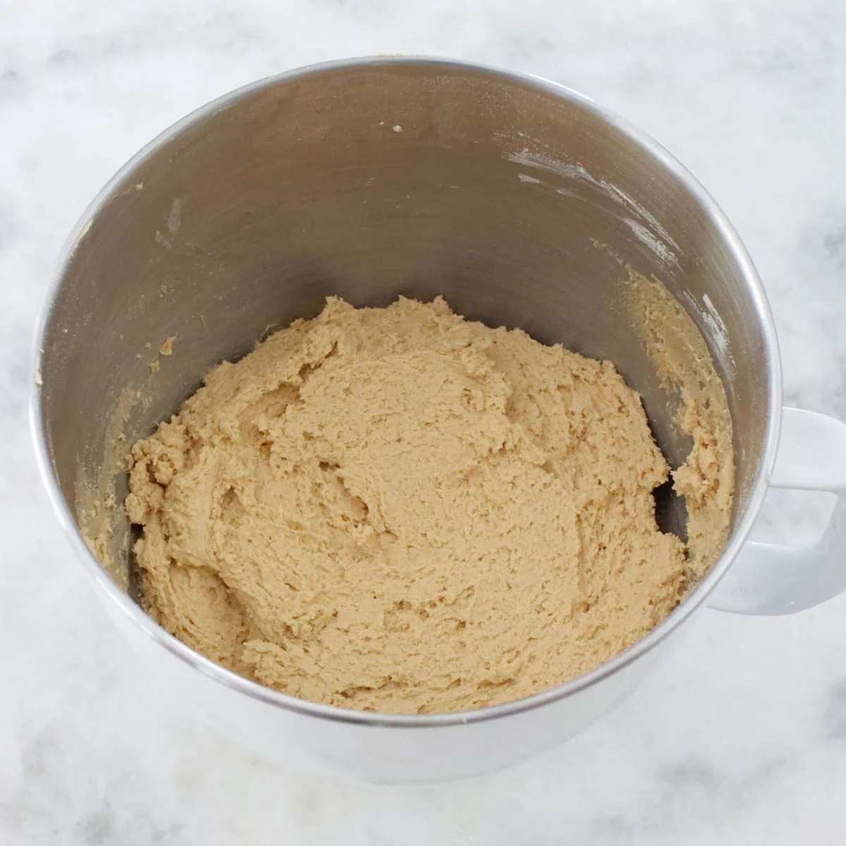 Soft raisin cookie dough in a bowl. 
