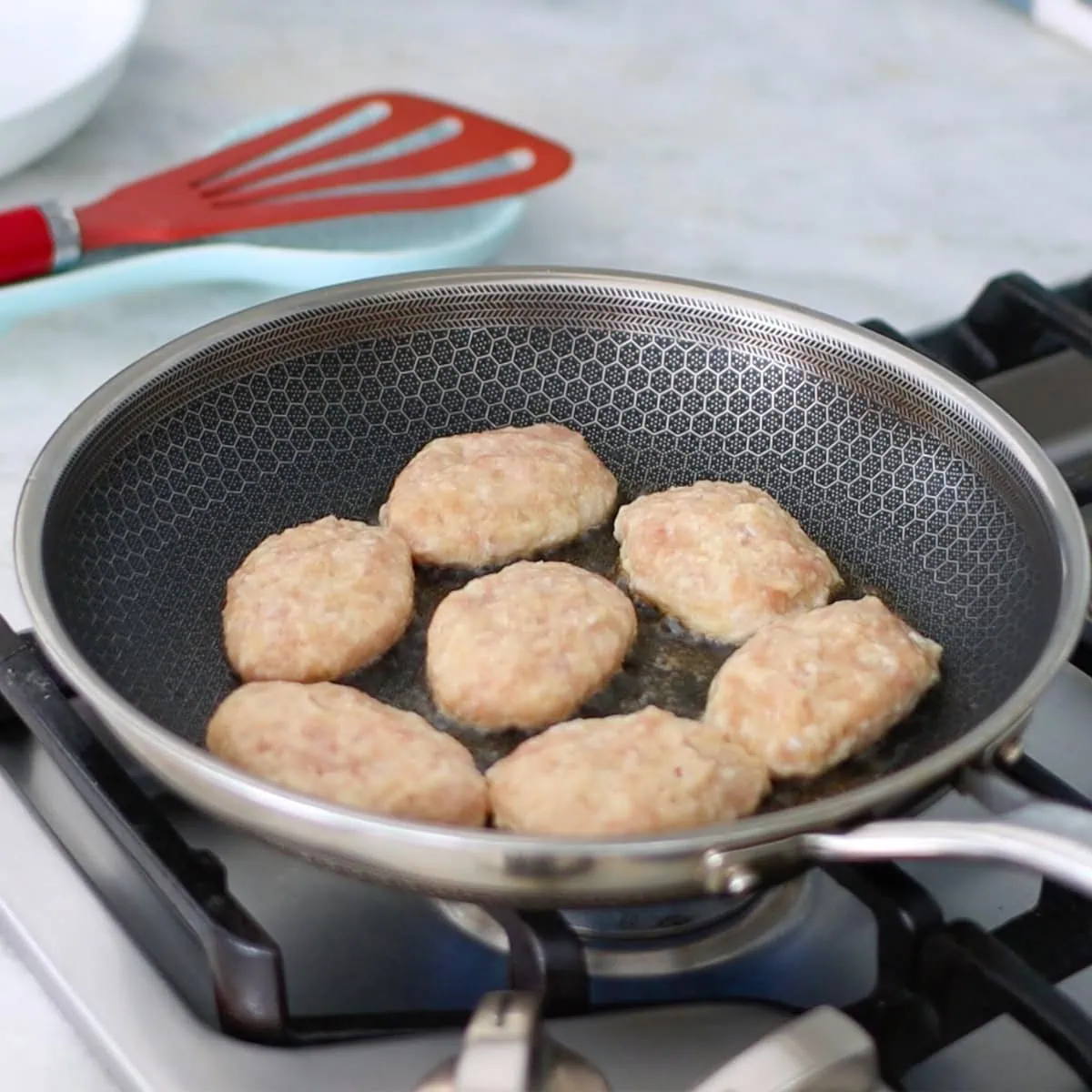 Chicken kotleti pan frying on the stove. 