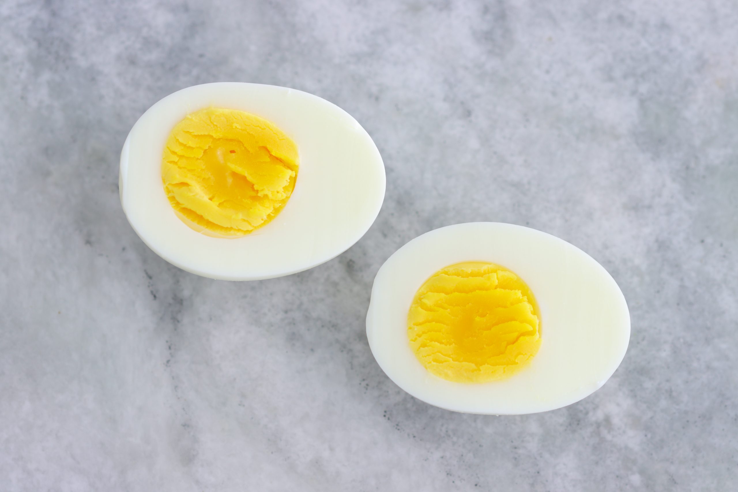 Boil Eggs. Deviled Eggs meaning. Hard-boiled Egg, yolk leaking out, real photo, detail.