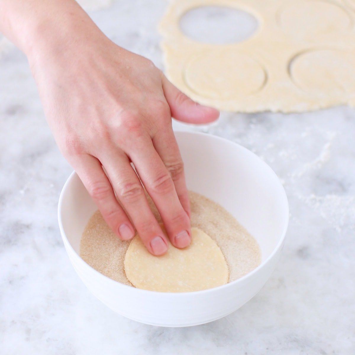 Farmer's cheese cookies - assembling, dipping in sugar.