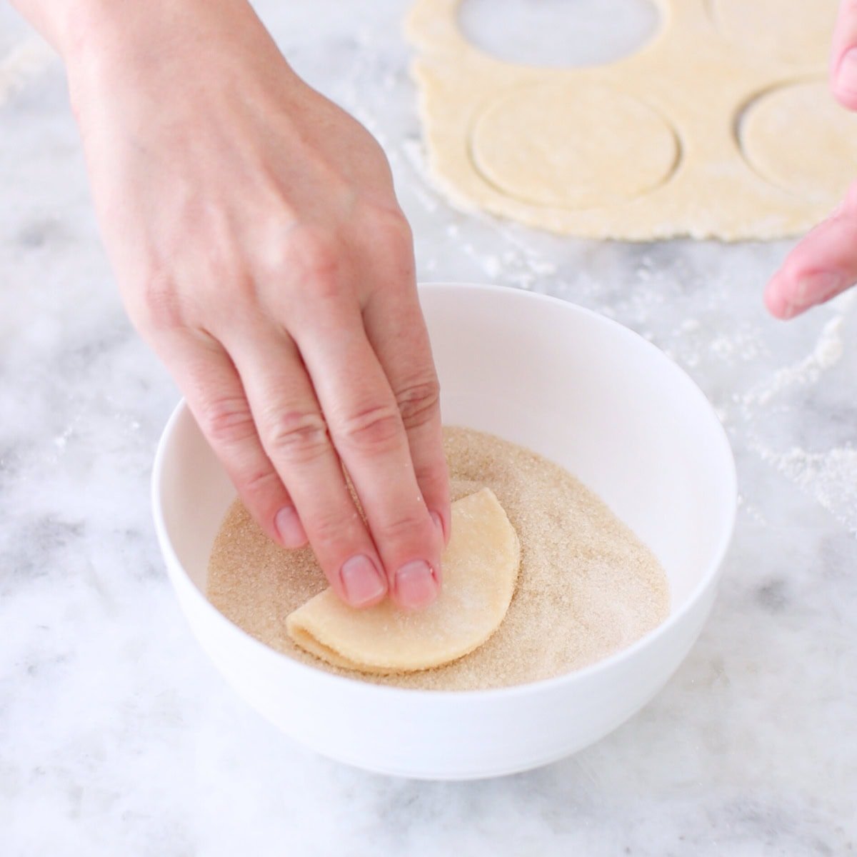 Farmer's cheese cookies - assembling, dipping in sugar.