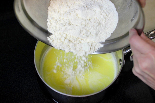 Adding flour to pate a choux dough2