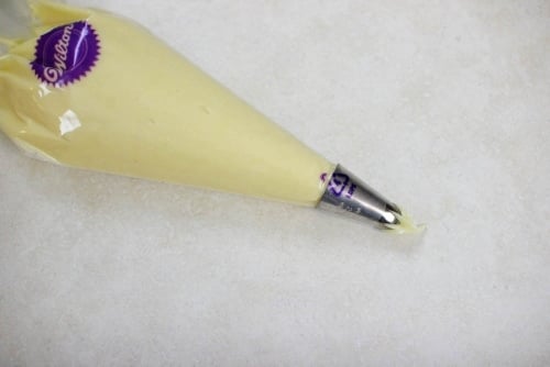 Pate a choux dough in a piping bag
