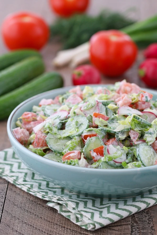 Sour Cream Vegetable Salad made with spring garden vegetables and a sour cream, dill and green onion dressing. 