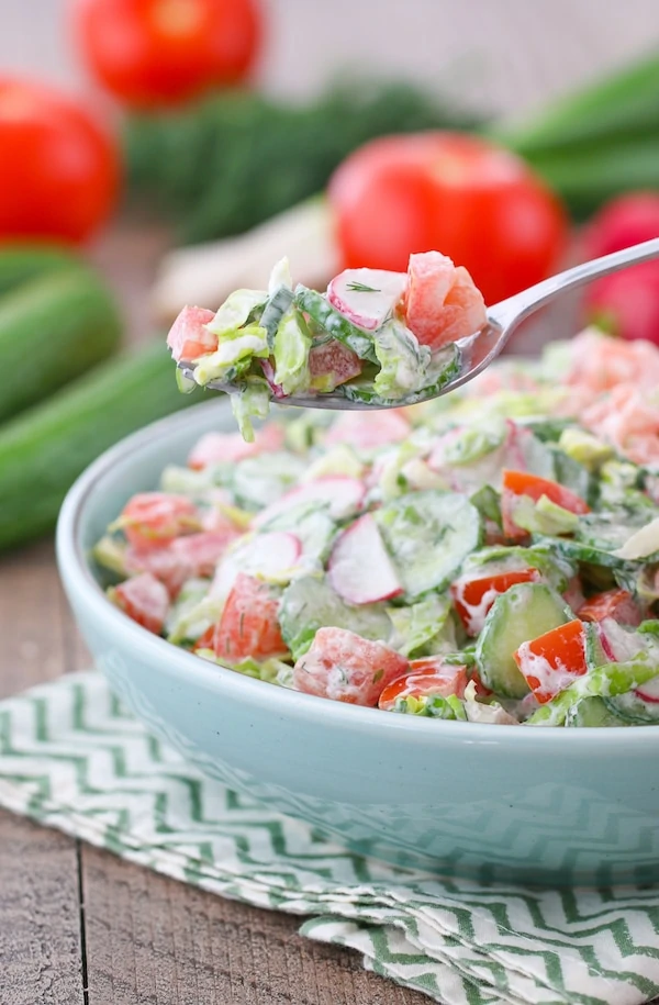 Sour Cream Spring Vegetable Salad with tomatoes, cucumber, radishes and lettuce