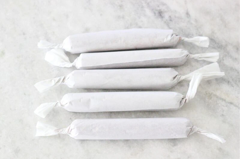 Chocolate salami wrapped in parchment paper - prep ahead and refrigerate or freeze