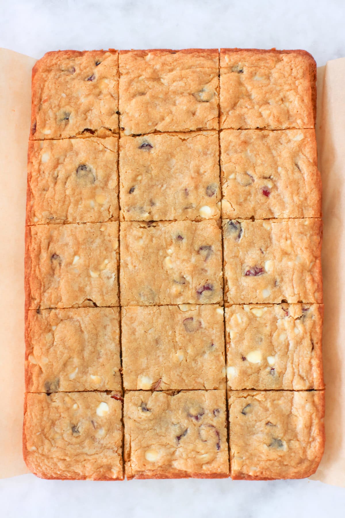 White Chocolate Macadamia Cookie Bars cut into pieces. 