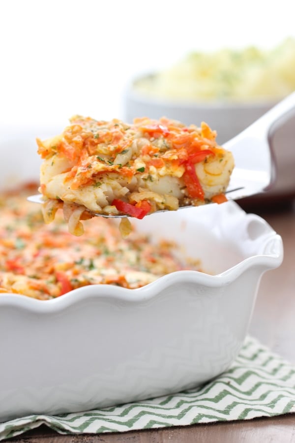 Baked White Fish With Vegetables, firm white fish baked in between layers of onion, celery, carrot, pepper and tomatoes.