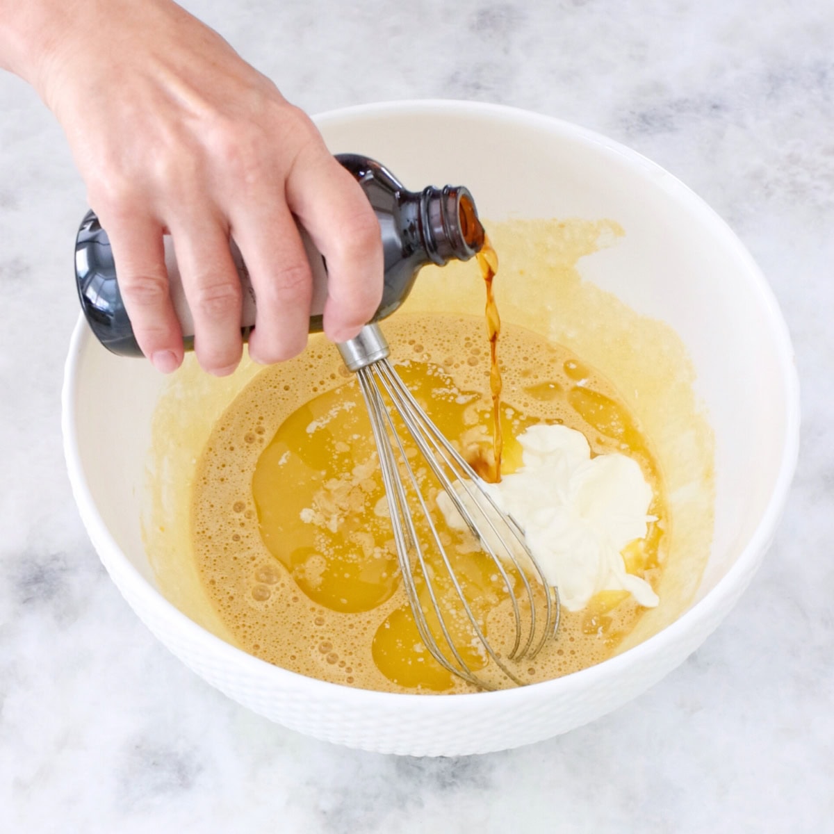 Banana upside down cake process, adding liquid ingredients.