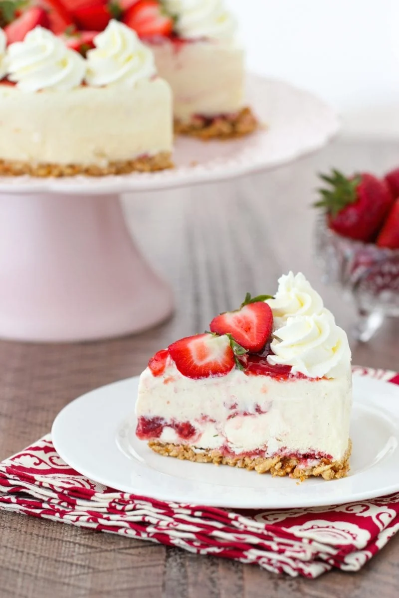 A slice of ice cream cake with strawberries