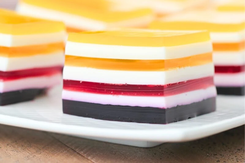 Layered Rainbow Jello using juice, close up of cut slice