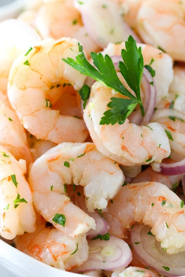 Lemon, parsley, garlic and shallot marinated shrimp appetizer 