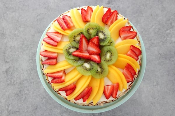 Honey Cake Topped With Fruit - Strawberries, Mangos and Kiwi