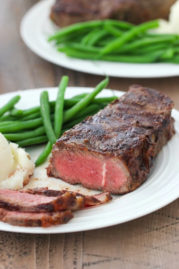 Grilled Steak, sliced, on a plate