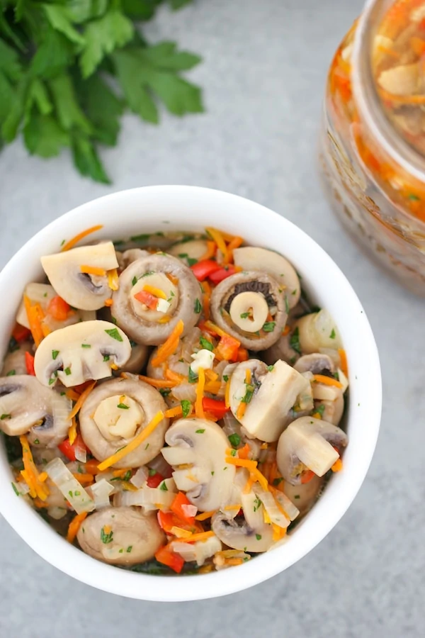 Close up shot of marinated mushrooms in a bowl 