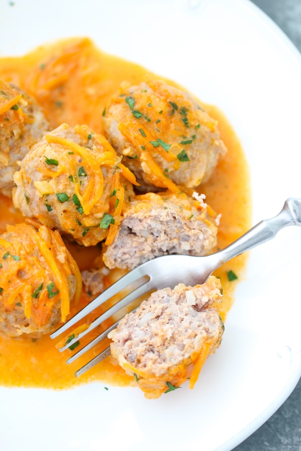 Tender porcupine meatballs with a carrot, onion, tomato cream sauce