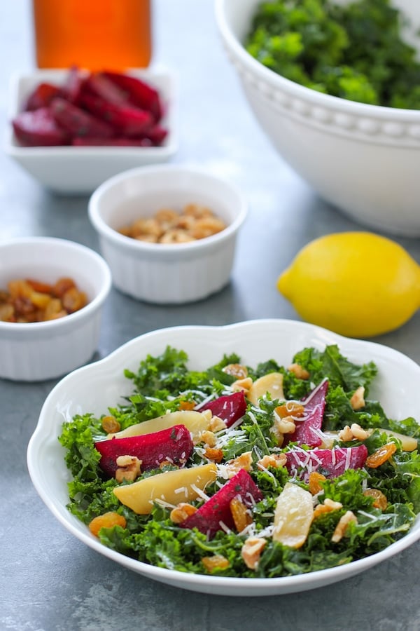 Kale Salad With Roasted Beets, apples, walnuts, raisins and a garlic, apple cider vinegar and honey vinaigrette.