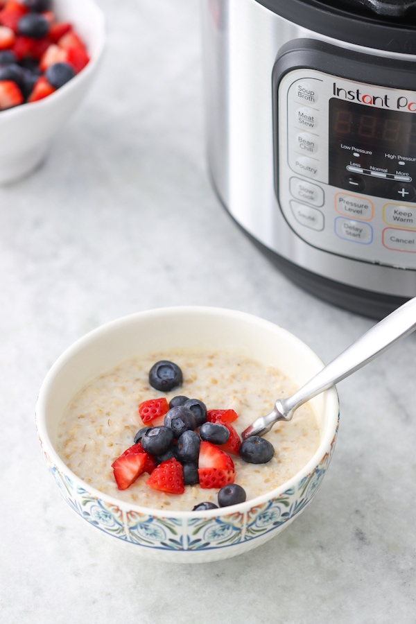 Steel Cut Oatmeal made in the Instant Pot topped with fresh berries, blueberries and strawberries