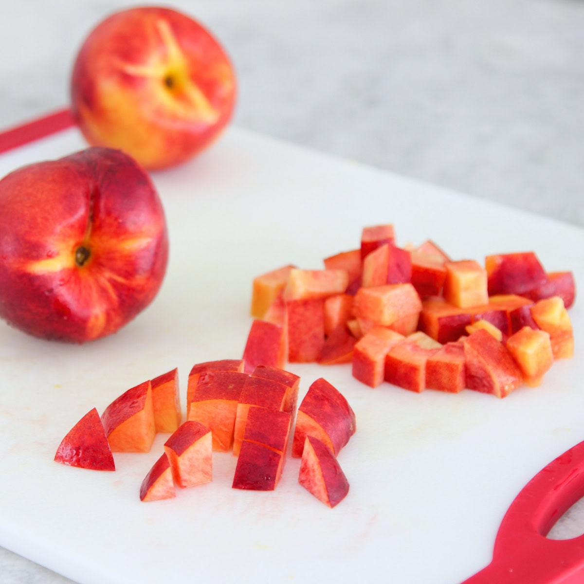 Chopping nectarines for fruit salad.