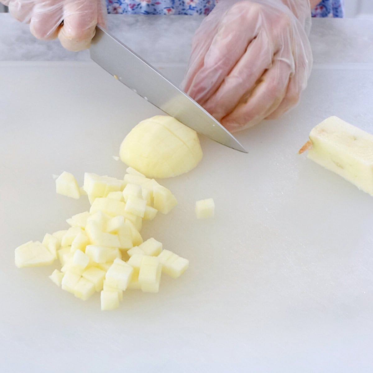 Chopping apples for fruit salad.