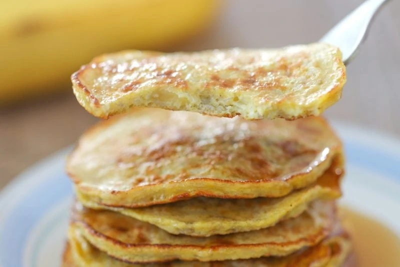 A close up, bite shot view of banana egg pancakes. 
