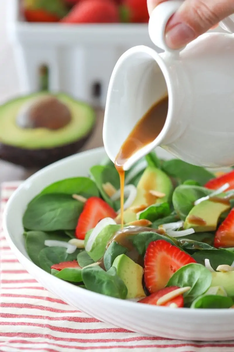 Strawberry Spinach Salad with avocados, shallot and balsamic dressing. 