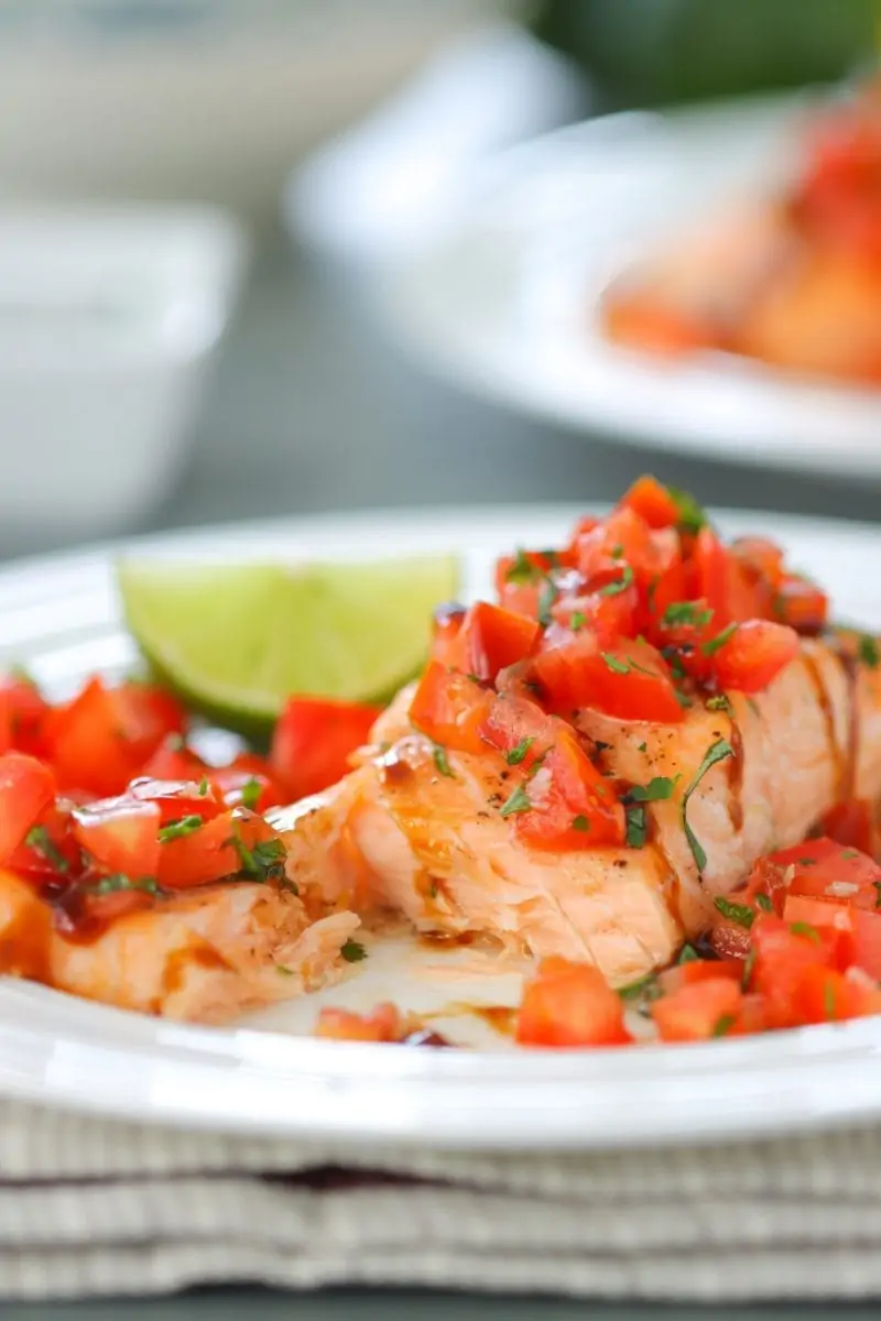 Oven Roasted Salmon - the fish is so juicy and the fresh tomato basil and garlic topping makes it beautiful and flavorful. 