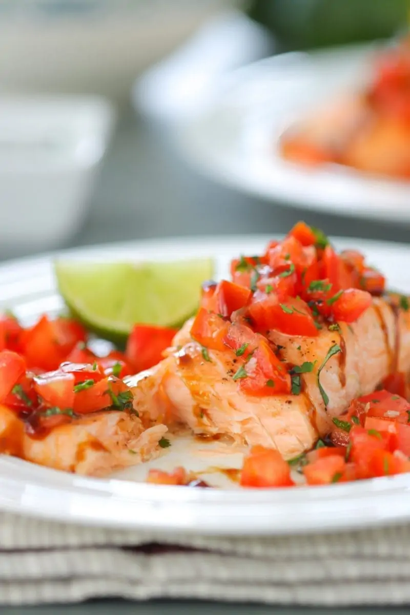 Oven Roasted Salmon - the fish is so juicy and the fresh tomato basil and garlic topping makes it beautiful and flavorful.