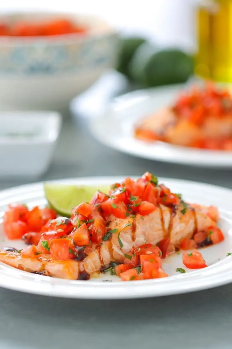 Oven Roasted Salmon with fresh tomato, basil and parsley topping. 