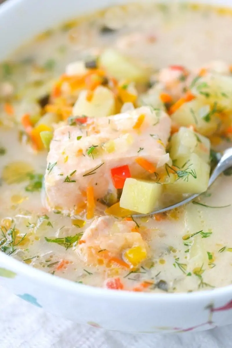 Salmon Soup that is so comforting made with lots of veggies, potatoes, fresh salmon and herbs. 