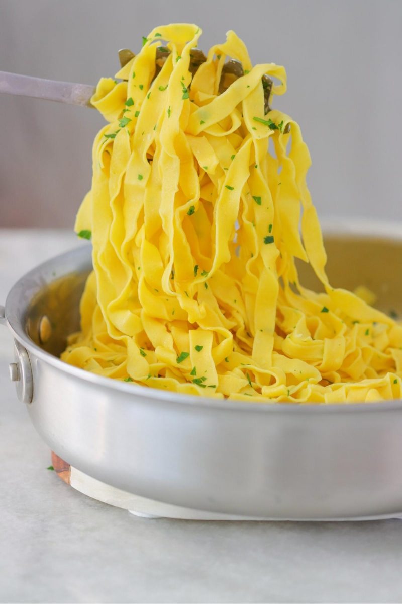 Homemade pasta served with garlic and parsley