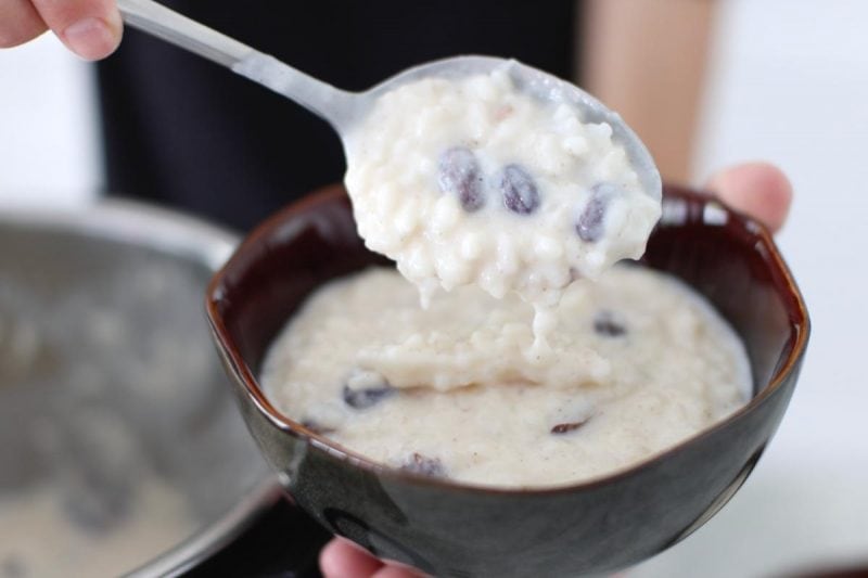 Creamy rice pudding made in the Instant Pot being spooned into a bowl 