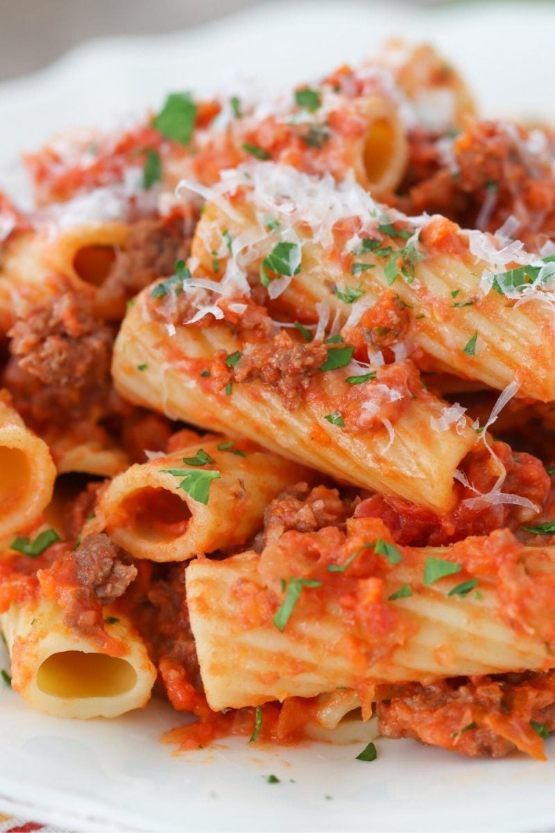 Quick and simple tomato meat sauce pasta. Ground beef, onion, carrots, celery and garlic in tomato sauce for pasta. 