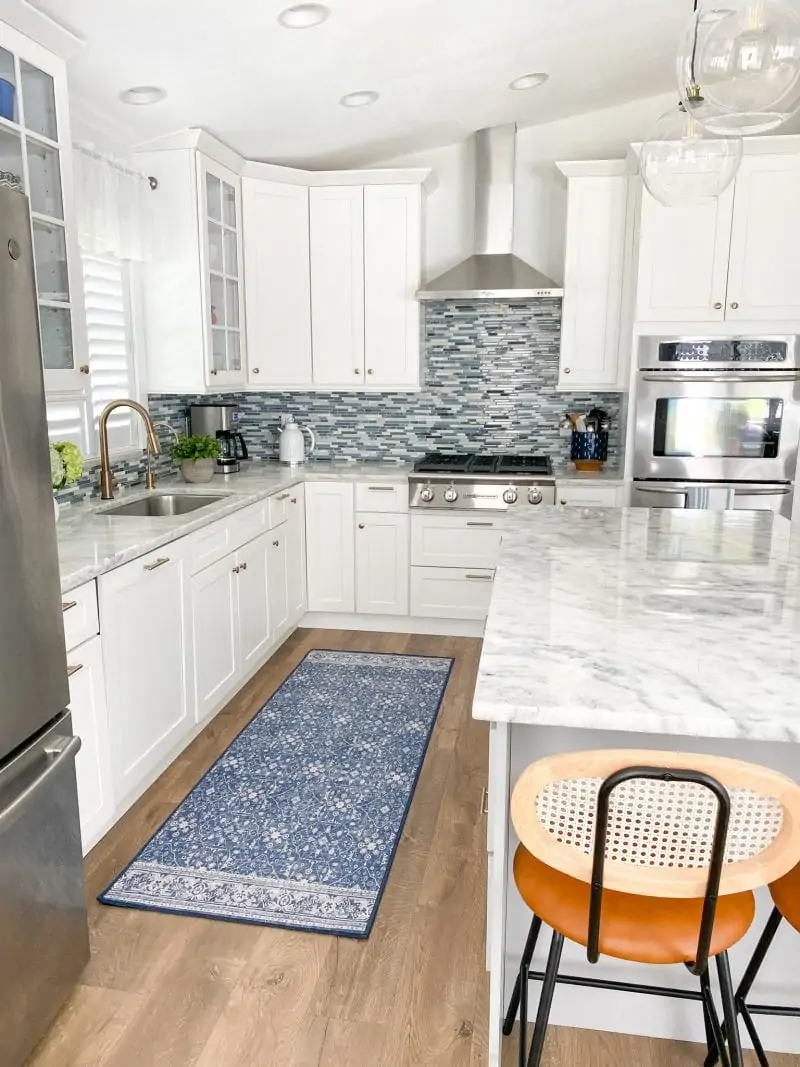 Kitchen Remodel 2022 
white and gray shaker cabinets, calcite marble counters, gas rangetop