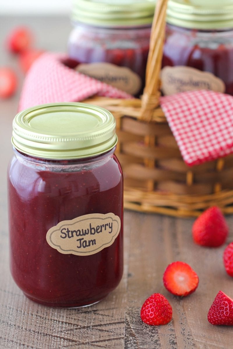 Jar of homemade strawberry jam using frozen strawberries. 