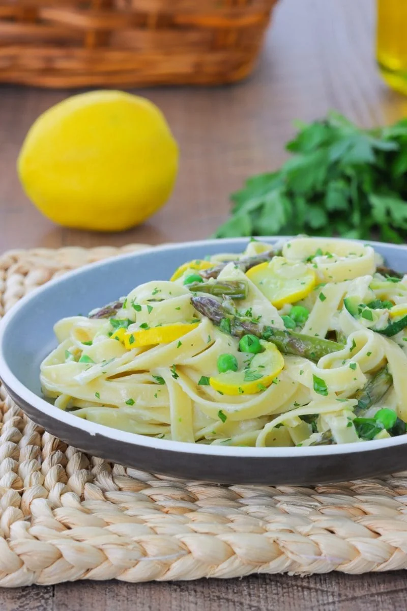 Pasta Primavera with roasted vegetables and a light cream sauce. 
(zucchini, yellow squash, asparagus, peas)