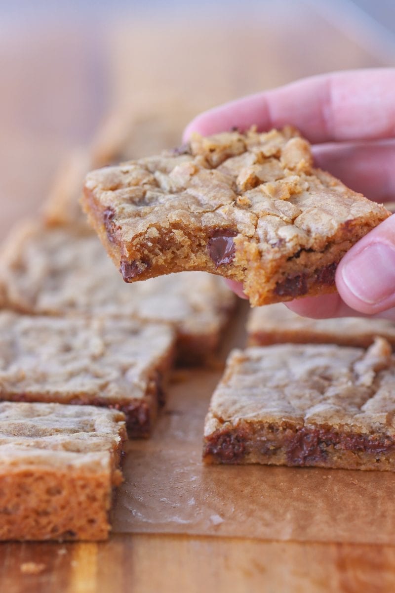 Brown Butter Chocolate Chip Cookies - holding up one cookie bar