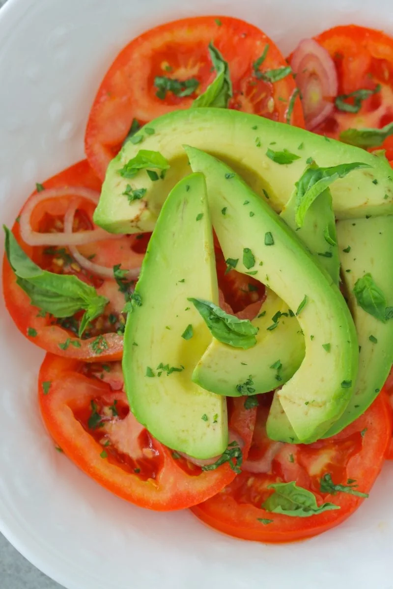 Tomato and Avocado Salad with shallots, parsley, basil and a simple vinaigrette