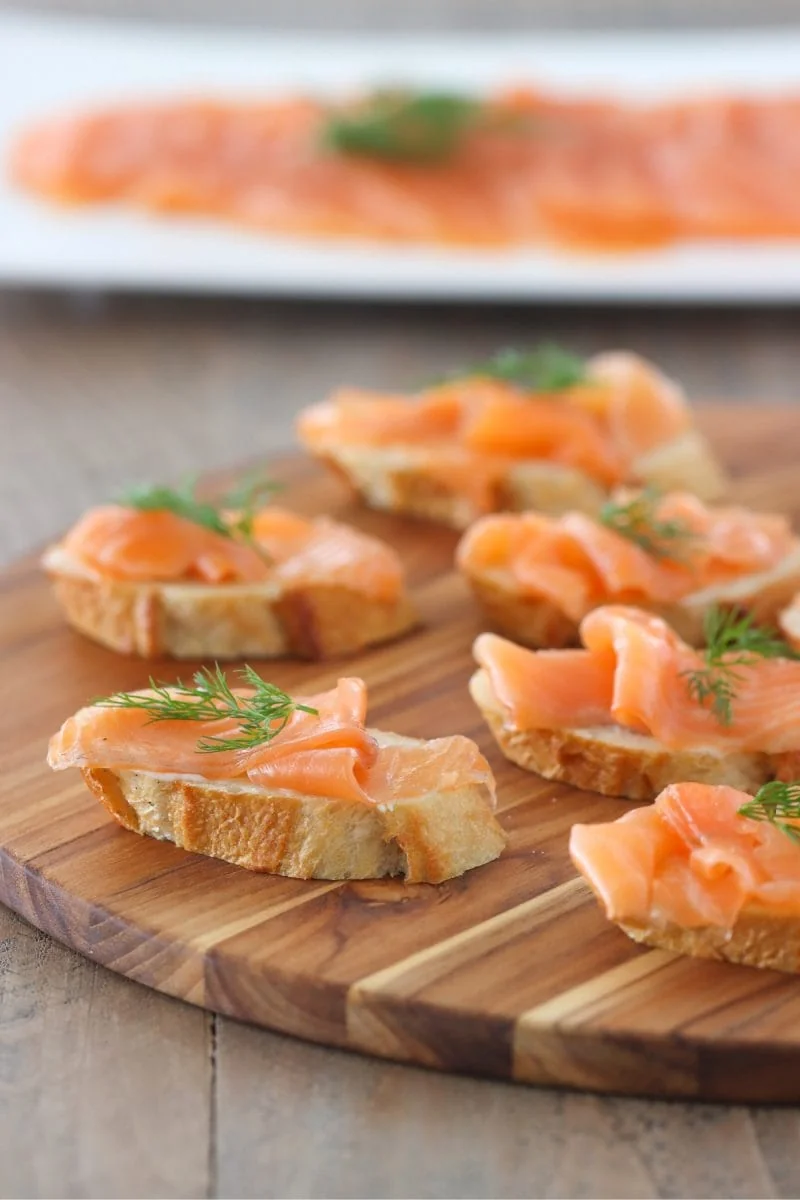 Salmon Gravlax - salt cured salmon with fresh dill, then thinly sliced and on an open faced sandwich.