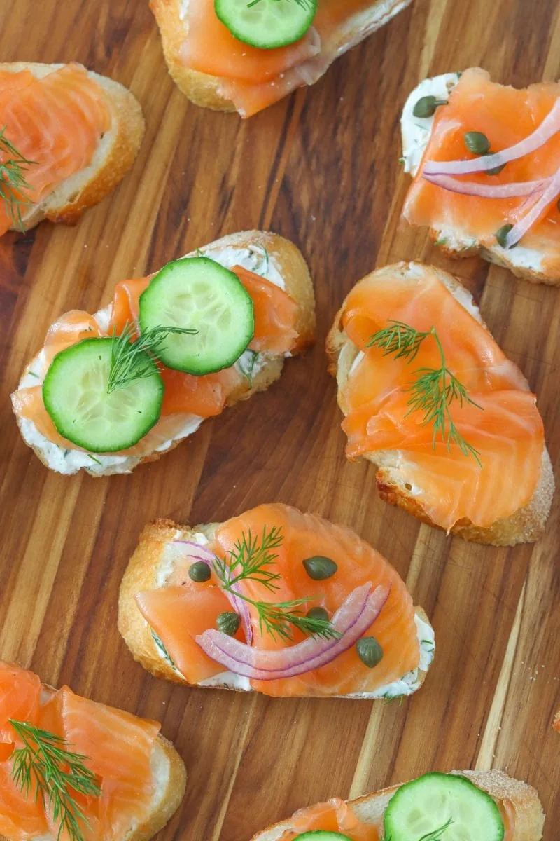 Salmon Gravlax sandwiches with dill, cucumber, pickled red onion, capers