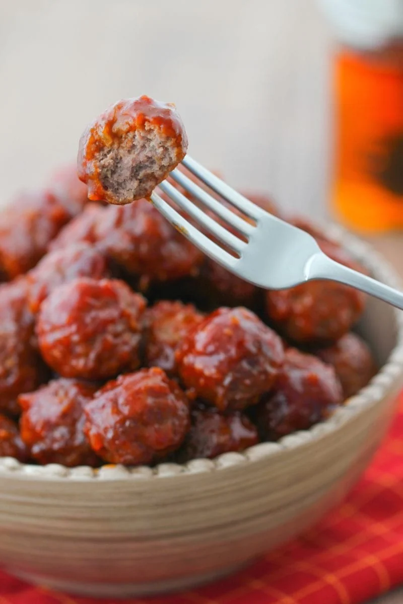 A bite of Honey Garlic Glazed Meatballs  