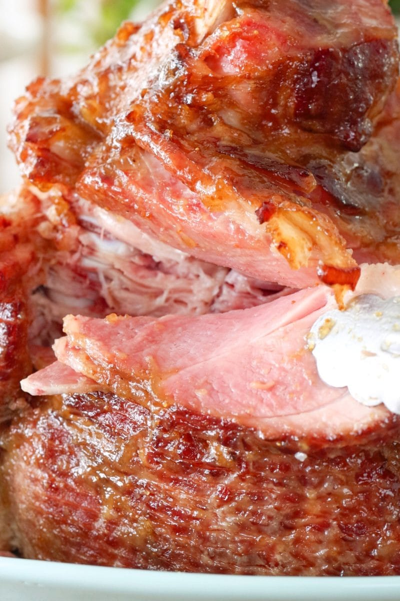 Close up of a spiral baked ham with a fig glaze