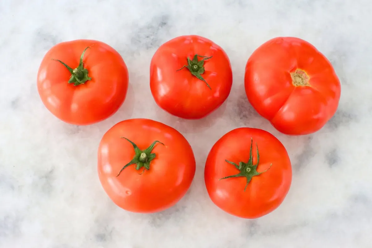 Beefsteak tomatoes to be used in Shakshuka on the counter. 